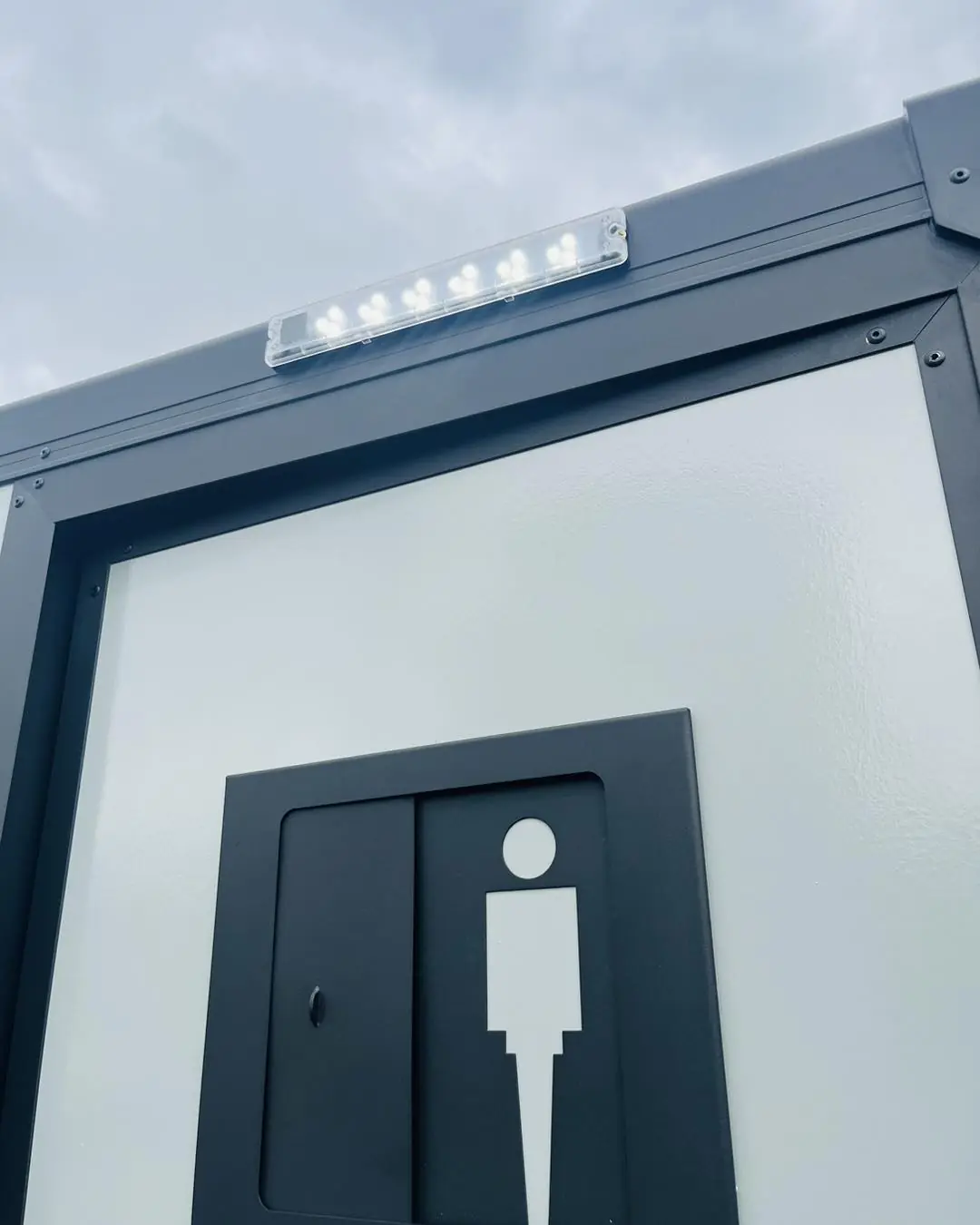 Men's side door of a restroom trailer